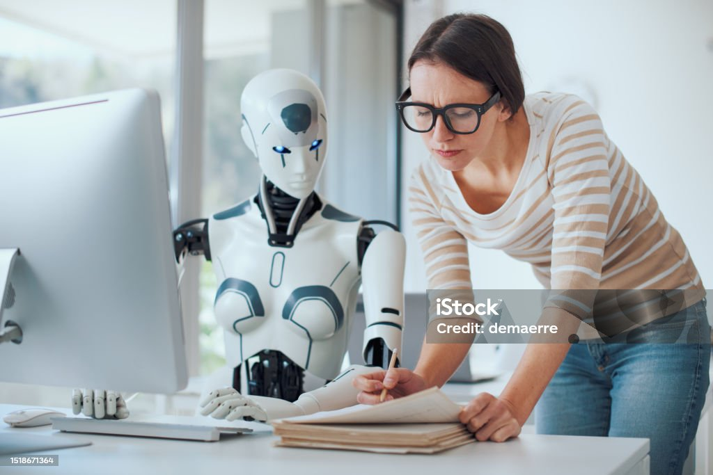 Woman and AI robot working together in the office, automation and technology concept